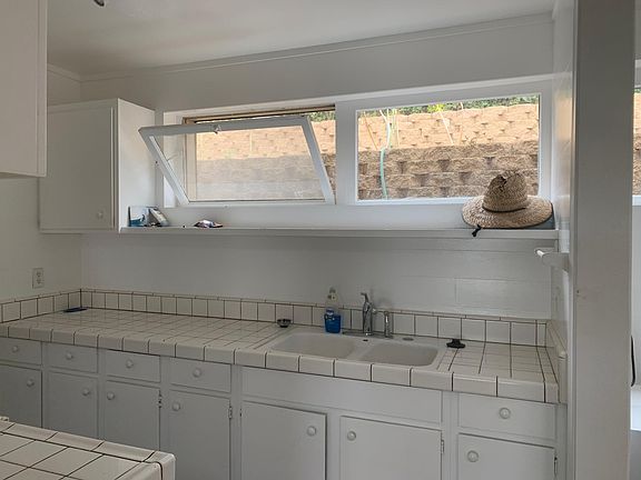 Kitchen; long pantry to left of kitchen which is storage and where ref ridge goes