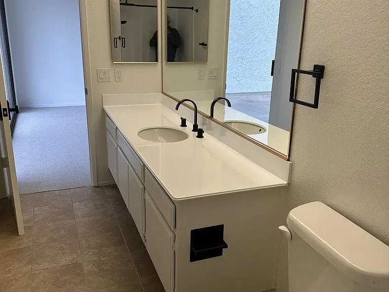 Primary Bedroom His & Hers Bathroom 1 of 2