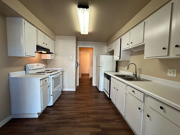 Kitchen with new stove/oven, dishwasher, refrigerator of lots of cupboard space.