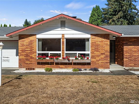 Adorable brick accent on the front of home.