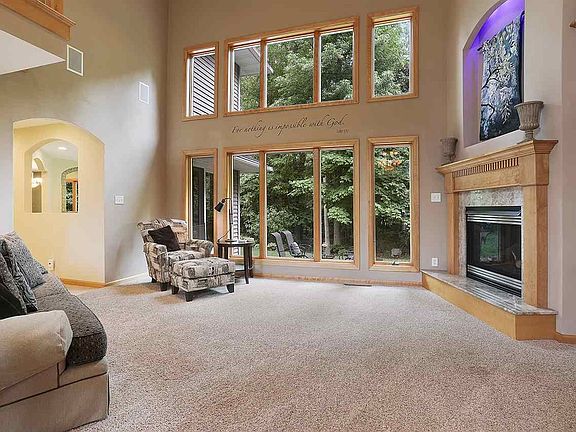 Living room with floor to ceiling and wall to wall windows brings the outdoors in!