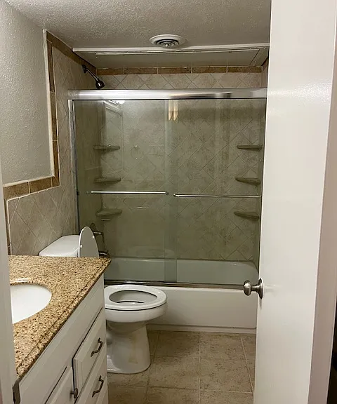 Hall bath with full tub and shower.