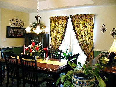 Formal Dining Room w/chair rail, trey ceiling, custom fixture, wood floors!