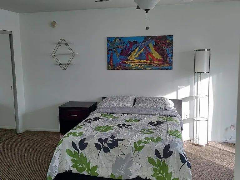 Upstairs front bedroom with attached bathroom.