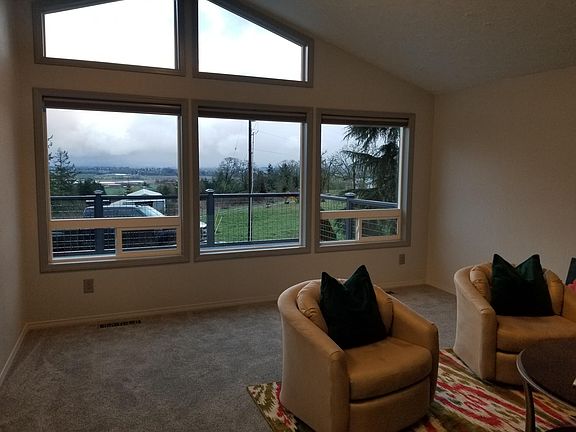 Vaulted Living room, floor to ceiling windows. Views! 