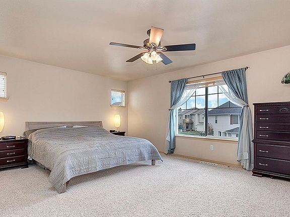 Spacious primary with private bath and walk-in closet