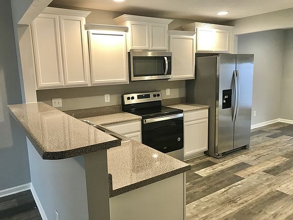 Great kitchen set up with room for breakfast table in back by door. Color combination is fantastic
