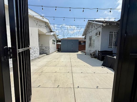 Private courtyard/parking area behind gate