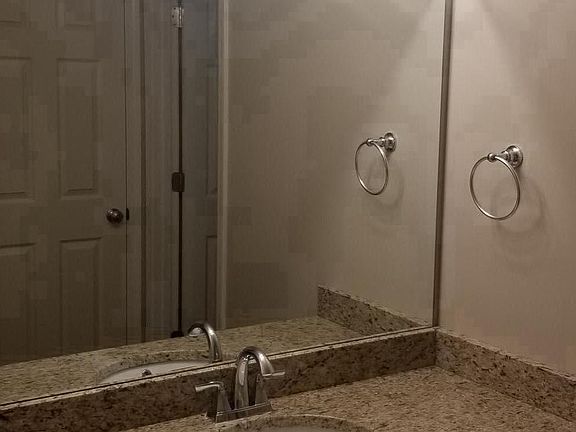 Guest bathroom with new granite countertops.