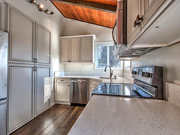 Kitchen with quartz countertops and stainless steel appliances