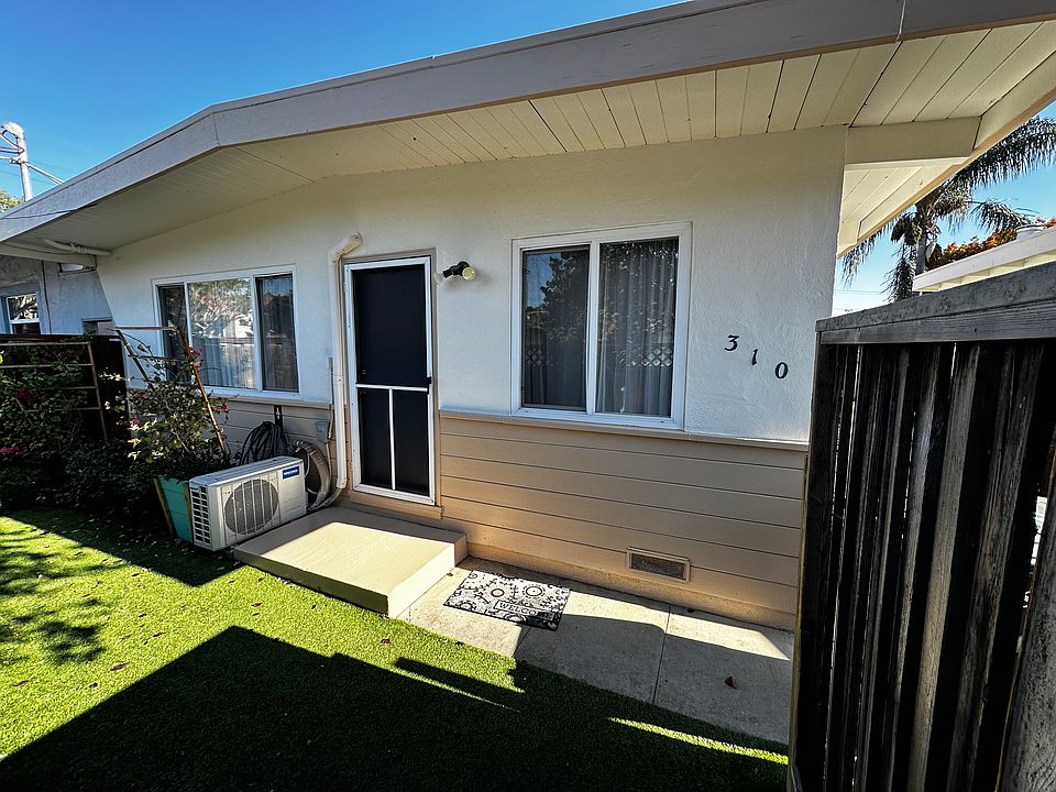 Newly painted exterior, front yard with gardening area and artificial grass