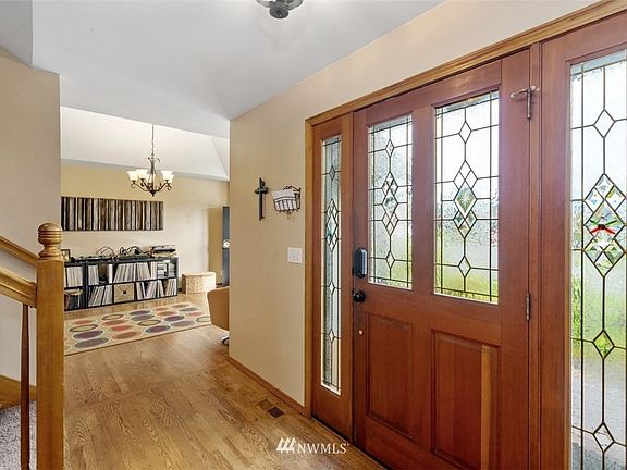 Entry Foyer facing Living Room. Gorgeous solid wood entry door with beveled glass gives classy feel to the front Foyer. Beautiful hardwood floors throughout the main floor!