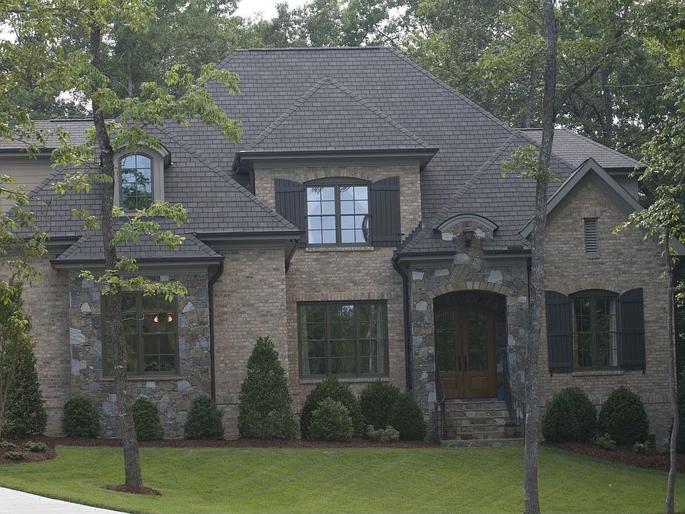 Natural stone from the Blue Ridge Mountains frames the portico.