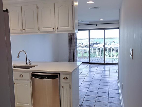 Kitchen, living room, and view of the bay