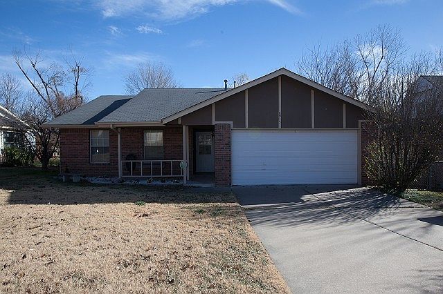 Updated brick home backs up to green belt area