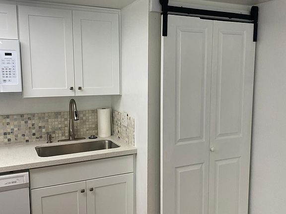 Kitchen with laundry area