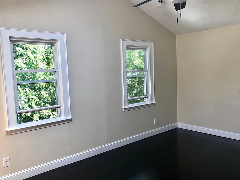 living room looking out at the treetops and down at the shared backyard!