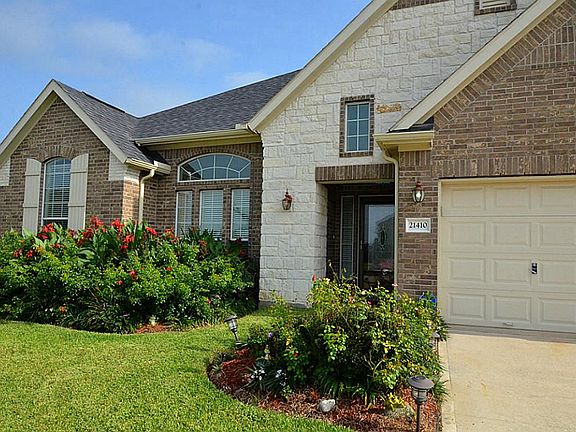 Luscious landscaping greets you on arrival to your new home.