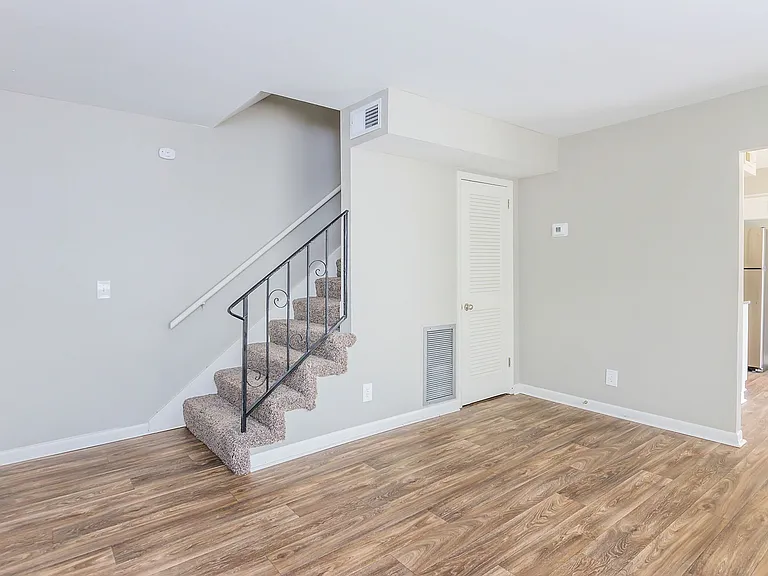 Spacious living room with hardwood-style flooring