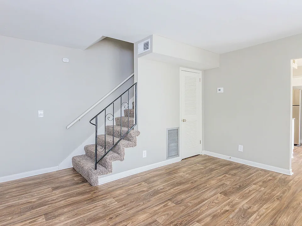 Spacious living room with hardwood-style flooring