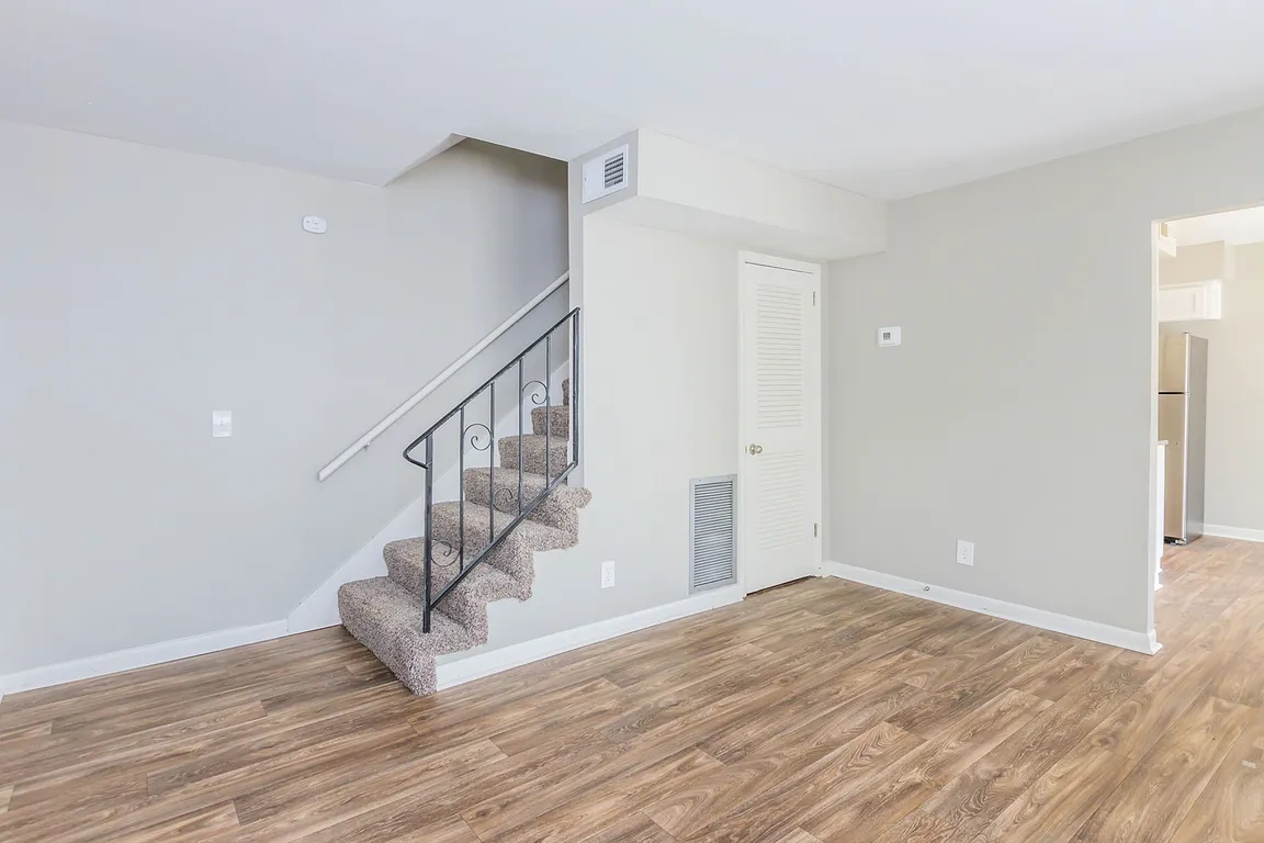 Spacious living room with hardwood-style flooring