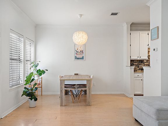 The dining room naturally opens to the living room and leads into the kitchen.