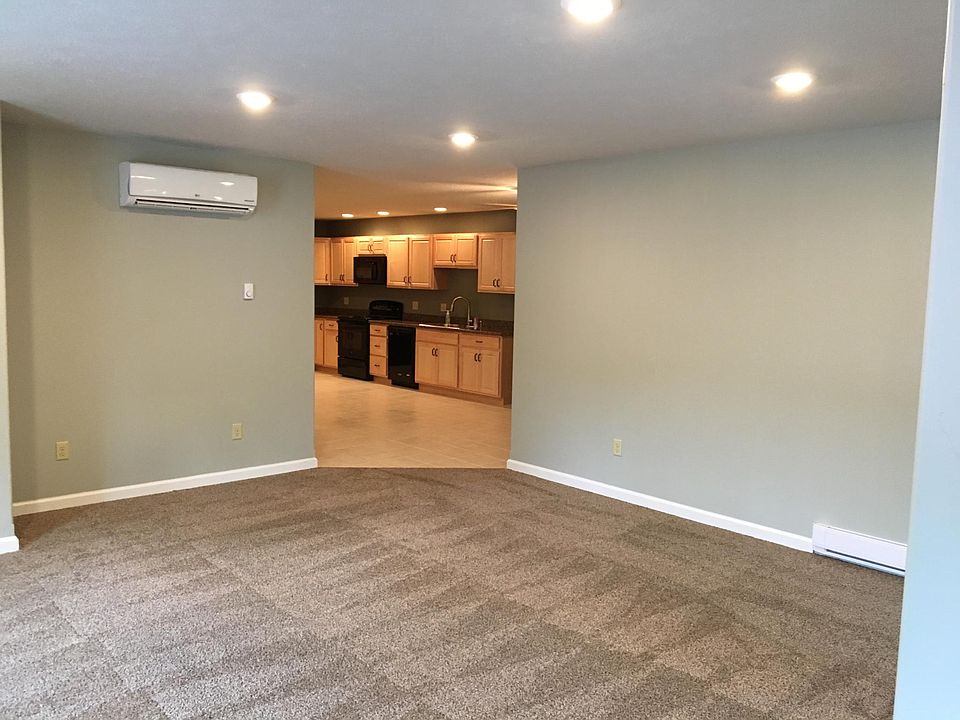 This is the living room looking from the second bedroom and also shows the kitchen.