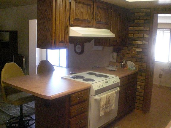 Lots of cabinet space with breakfast bar!