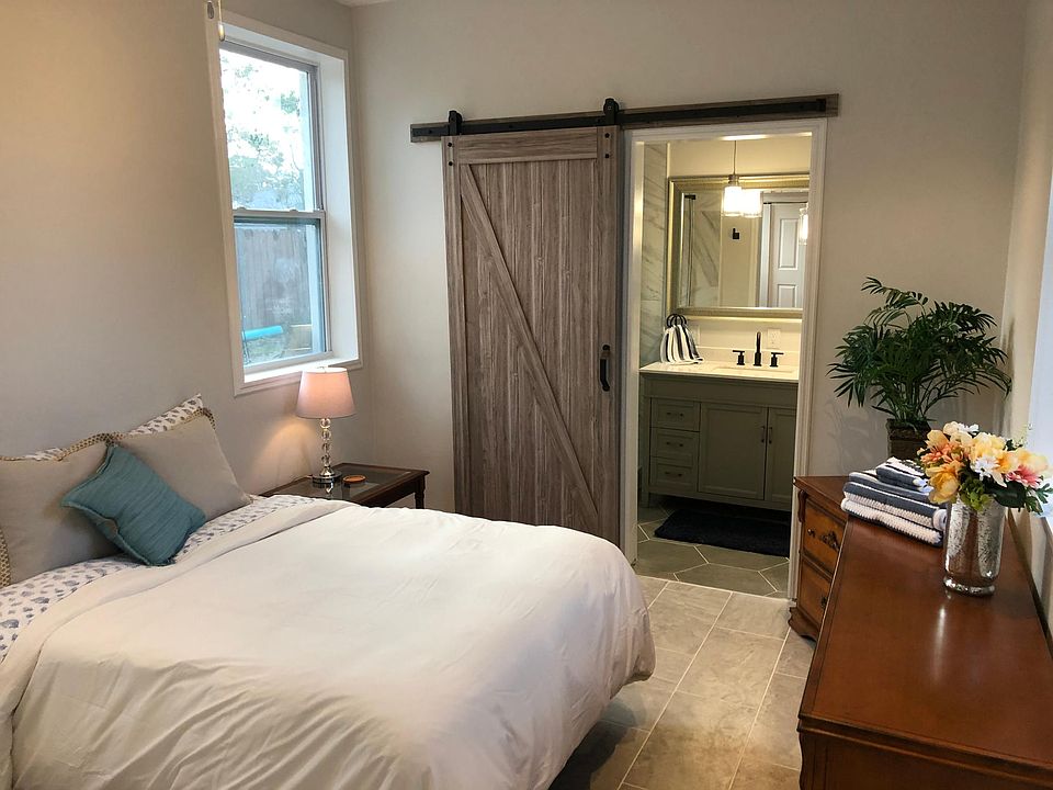 Master bedroom with barn door bathroom