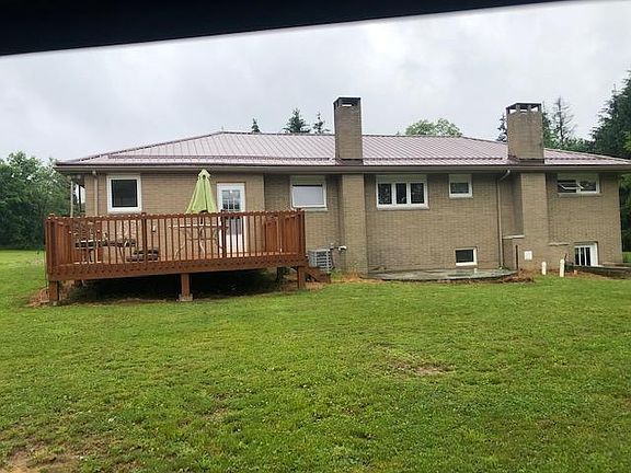 Convenient deck right off of the 1st floor laundry room. Great view of the neighbors horses.
