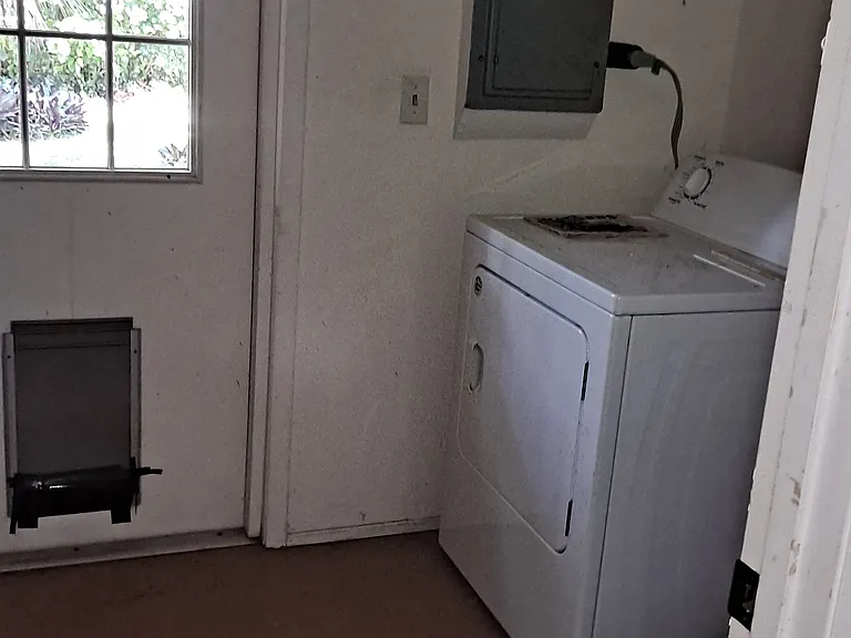 Utility room with dryer