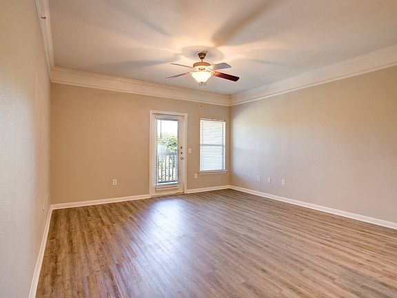 Spacious Living Room with Hardwood-Style Flooring