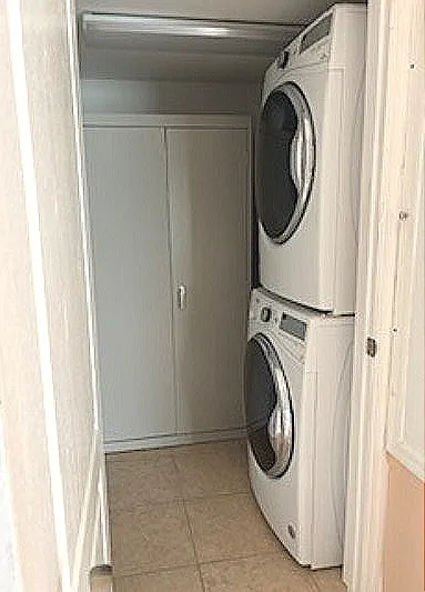 Washer and Dryer. Cabinet against the back wall.