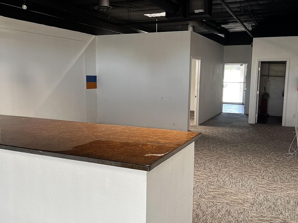 Large counter separates waiting area from main workspace.