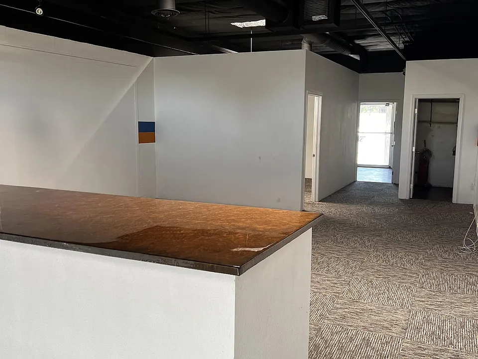 Large counter separates waiting area from main workspace.