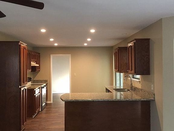 Kitchen with granite counters.