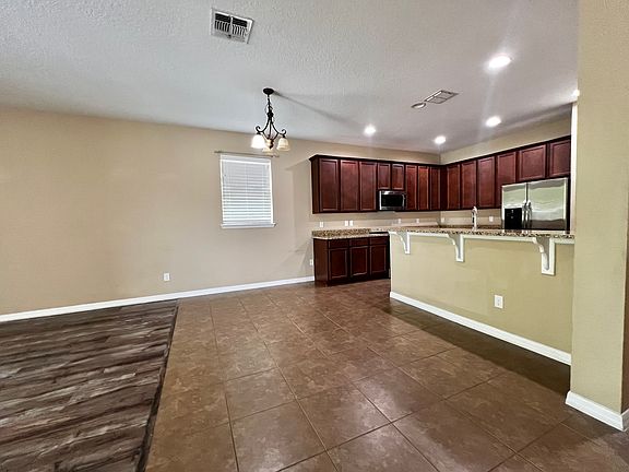 OPEN CONCEPT AND BEAUTIFUL, DINING ROOM AND BAR SO PLENTY OF SPACE TO ENTERTAIN!