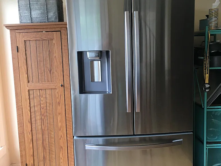 French door refrigerator with ice and water dispenser included