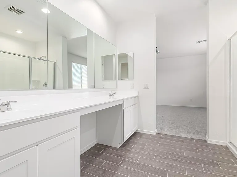 Two sink wash are in master suite