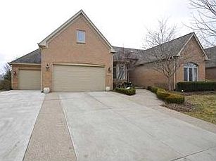 Gorgeous all brick home featuring a finished 3 car garage.