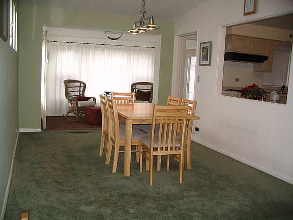 Step up to the formal dining area, which also opens to LR, sunroom & kitchen