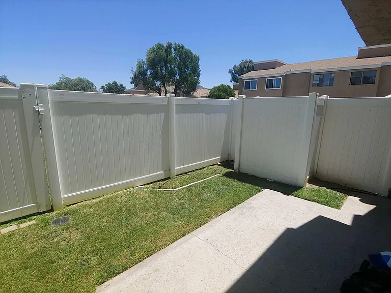 Gate goes to grassy area and the pool. The gate can be locked.
