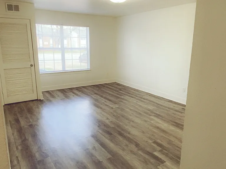 1 bedroom unit: living room with large double windows