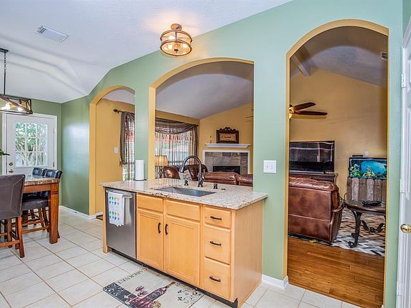 Open kitchen, breakfast area, and living room