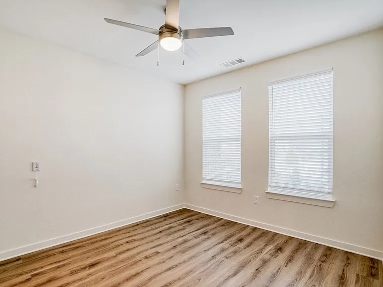 Unit Bedroom with Ceiling Fan and 2 Windows