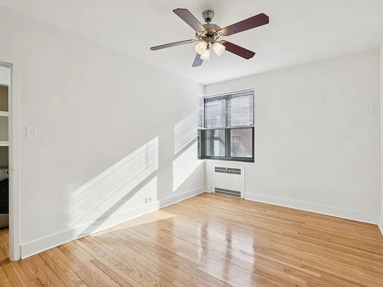 Primary Bedroom (looking into hallway with in-unit washer/dryer combo)