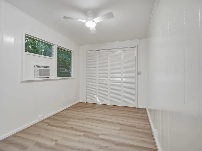 There is also a ceiling fan in the bedroom.