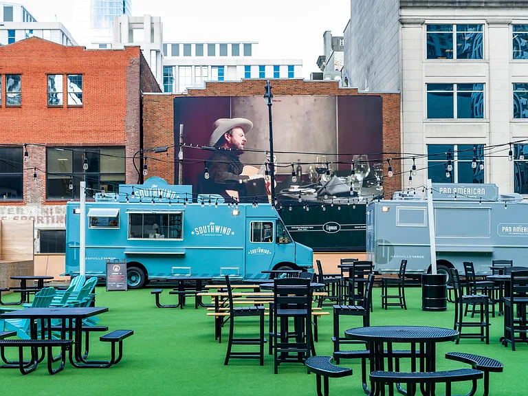 Just outside Modera McGavock, local food trucks and outdoor dining bring bold flavor and community energy to Nashville Yards.