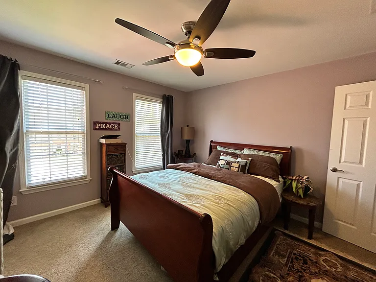 Sunny, well-lit guest bedroom, complete with a welcoming family-friendly feel.(optional furnitshing)