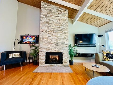 Living Area: Stunning Brick Gas Fireplace and high vaulted ceilings